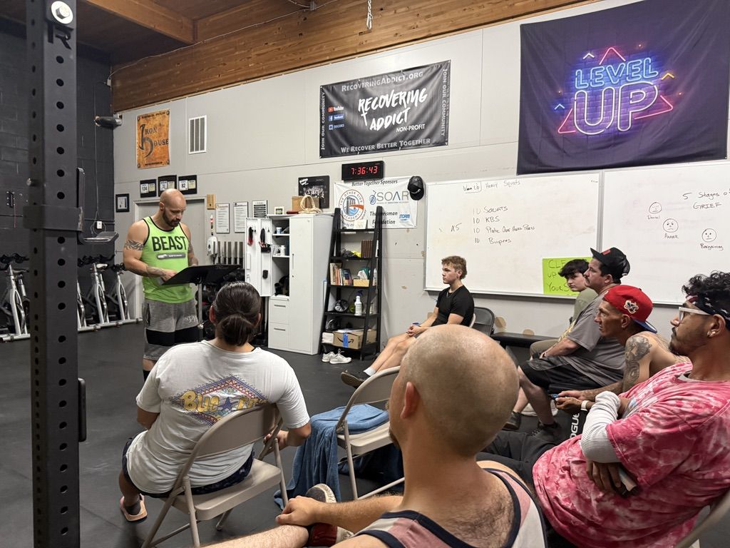 A leader speaking with the group during a Recovering Addict meeting in Ogden