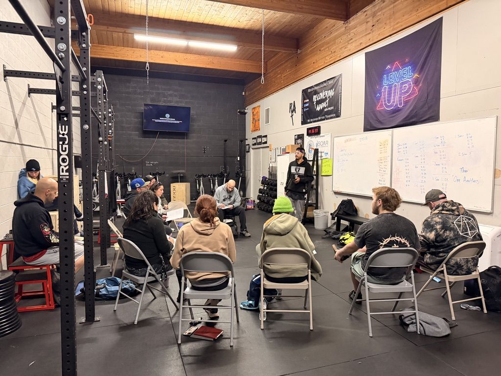 A Recovering Addict meeting in Ogden, with the ministry banner on the gym wall